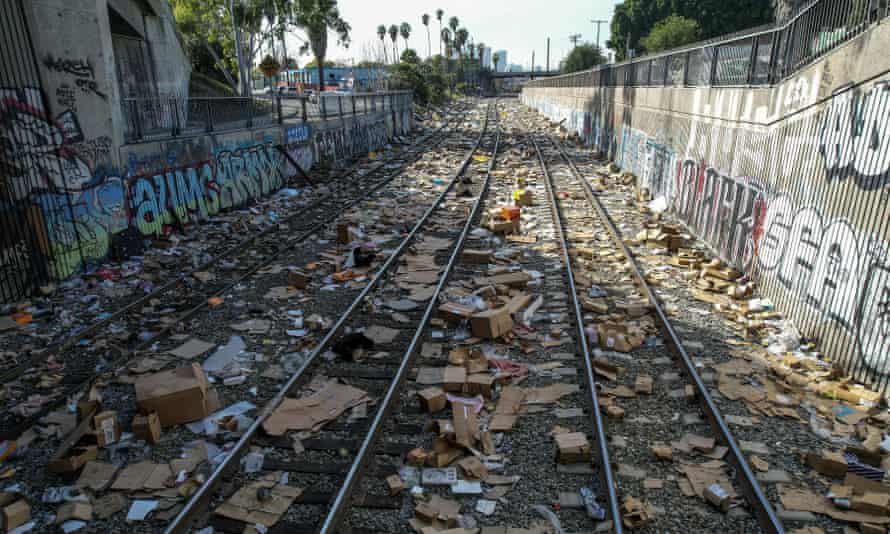Shredded boxes, luggage, and debris are scattered along some of the Union Pacific railroad tracks in downtown Los Angeles.