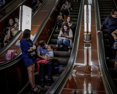 People shelter inside a subway station during an air raid alert, amid Russia’s attack on Ukraine, in Kyiv
