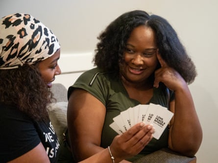 a woman holding cards