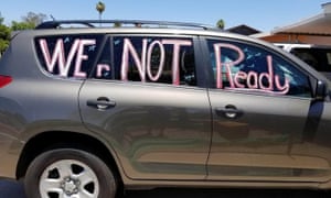 A slogan is seen on a car in a ‘motor march’ by teachers calling for a delay in returning to schools, in Phoenix, Arizona