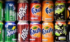 Cans of fizzy drinks on supermarket shelf