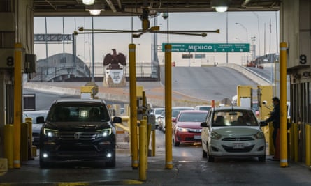 Customs and Border Protection agents check documents of people entering the US at the Bridge of the Americas in El Paso, Texas on 8 November 2021.