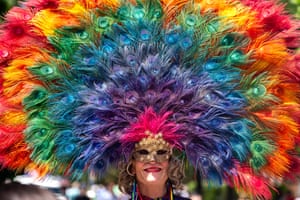 A person in a colourful feathered headdress