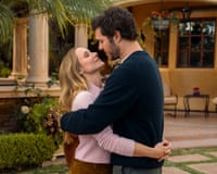 Joanne and Noah with their arms around each other in front of a really nice property
