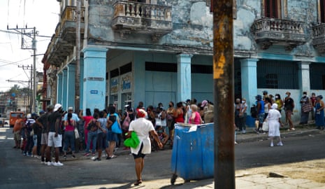 Cubans queue to buy food in Havana.