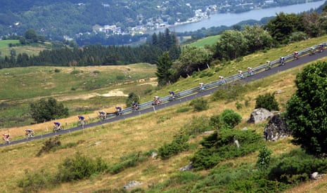 The riders head downhill after a bib climb