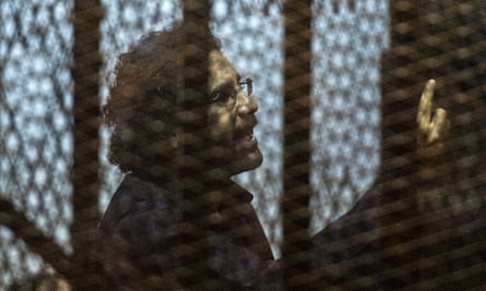 Alaa Abdel Fattah in the defendant’s cage during his trial in 2015 for insulting the judiciary.