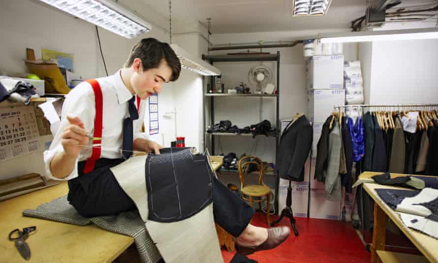 An apprentice coatmaker at Henry Poole & Co on Savile Row.