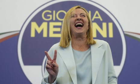 Brothers of Italy leader Giorgia Meloni flashes the victory sign at her far-right party's electoral headquarters in Rome on Monday.