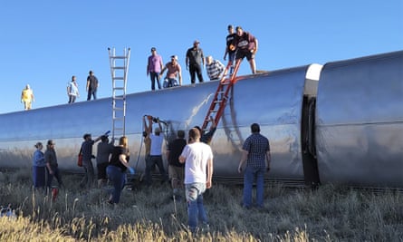 People work at the scene of the train derailment in Montana