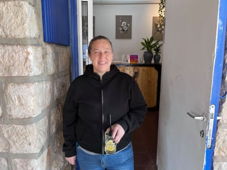 Miry Menashe stands in the doorway of her cafe