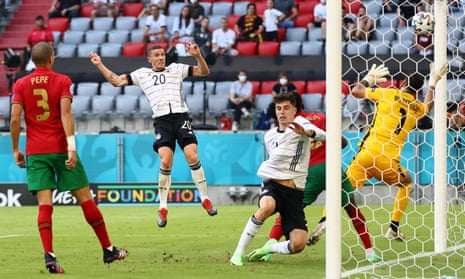 Germany’s Robin Gosens heads home their fourth goal.
