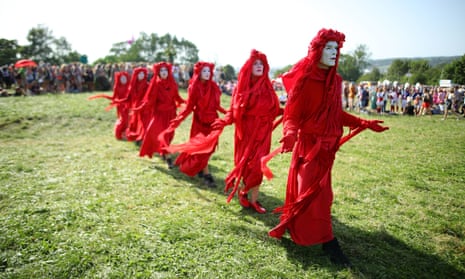 Extinction Rebellion and Greenpeace stage a climate change march on the second day of Glastonbury.