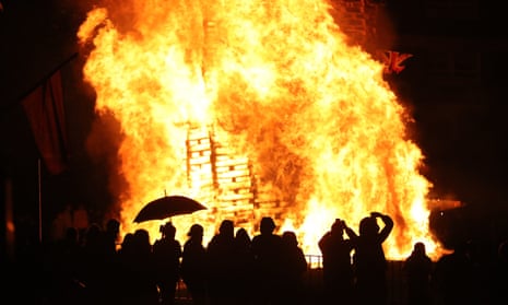 Bonfire in north Belfast<br>Crowds watch as a bonfire is lit in the New Lodge area of Belfast to mark the anniversary of the introduction of the controversial policy of internment without trial.. PRESS ASSOCIATION Photo. Picture date: Thursday August 8, 2019. See PA story ULSTER Bonfire. Photo credit should read: PA Wire