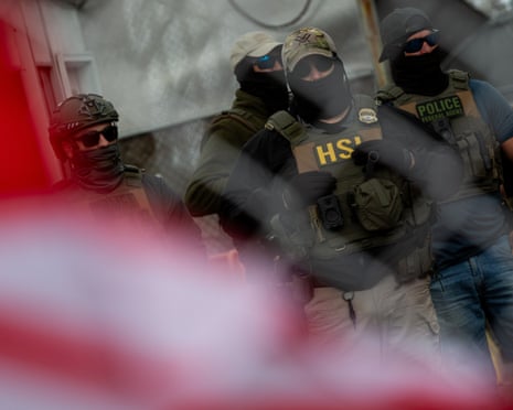 Masked men in camouflage and bulletproof vests.