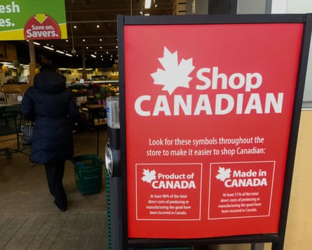 A poster in a shop entrance advertises the symbols ‘Shop Canadian’, ‘Product of Canada’ and ‘Made in Canada’