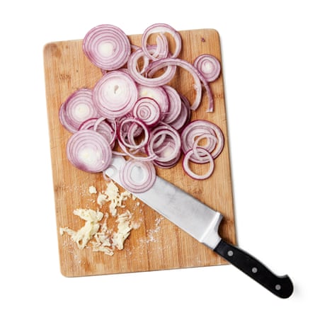 Felicity Cloake’s chicken tagine 01a. Peel and thinly slice the red onions lengthways. Peel the garlic, then mash it with half a teaspoon of salt (I do this in a mortar, but you could also do it with the flat side of a heavy knife).