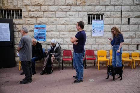 Voters line up before a polling site in Jerusalem.