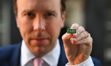 Health Secretary Matt Hancock shows off the new Care badge designed to honour social care workers