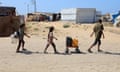 Displaced children fetch water at al-Mawasi area in the southern Gaza Strip city of Khan Younis.