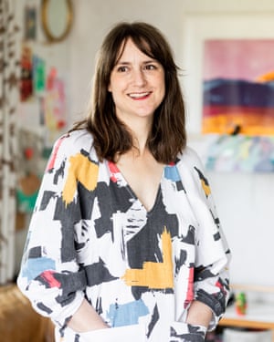 Rachael Łukowski poses for a portrait in her living room