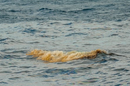 Brown foam seen on waves