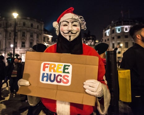 A protester in a Guy Fawkes mask, central London