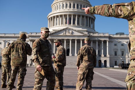 Members of the National Guard patrol outside the US Capitol today.