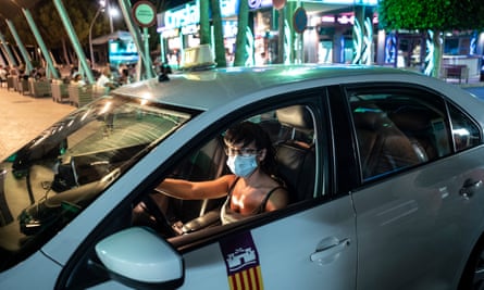 Xenia Mon in her taxi, with Crystal’s bar in the background