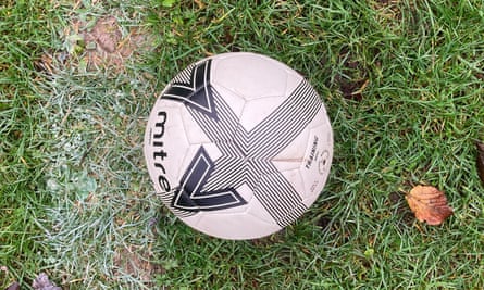 A ball in a park in London that is not completely over the line.