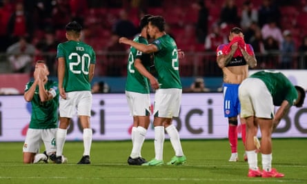 Bolivia players celebrate at the final whistle in Santiago.