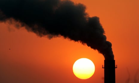 Steam billows from a power station during sunset in New Delhi.
