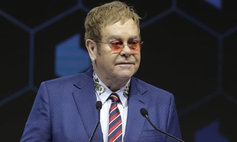 British musician Sir Elton John delivers a speech during the ceremony for the Crystal Awards on the eve of annual meeting of the World Economic Forum in Davos tonight.