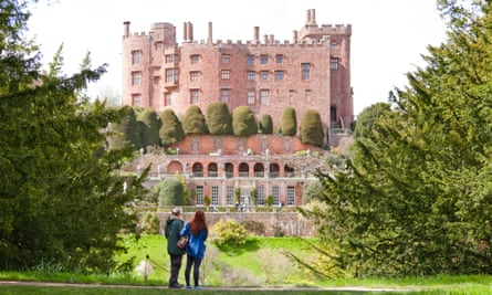 Visitors in the garden at Powis Castle and Garden, Powys, Wales.