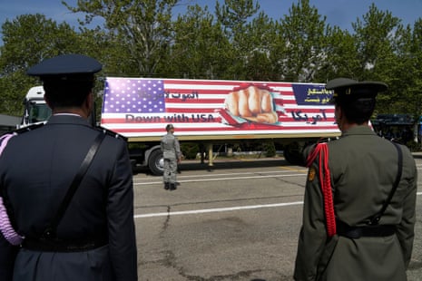 An anti-U.S. banner is carried on a truck during the army day parade in Tehran.