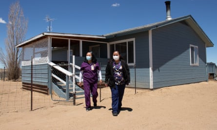 Navajo Nation tribal employees and certified nursing assistants Payton Willeto and Pamela Borja on their rounds.
