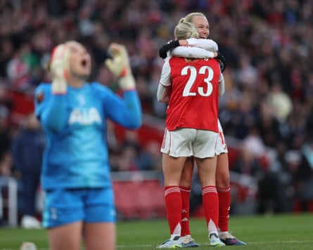 Alessia Russo celebrates her third goal with Arsenal teammate Frida Leonhardsen Maanum, while Tottenham goalkeeper Lize Kop shows her frustration at having conceded.
