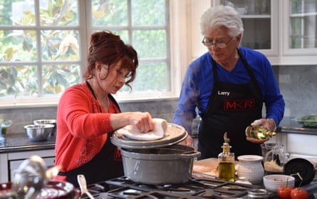 two people cooking