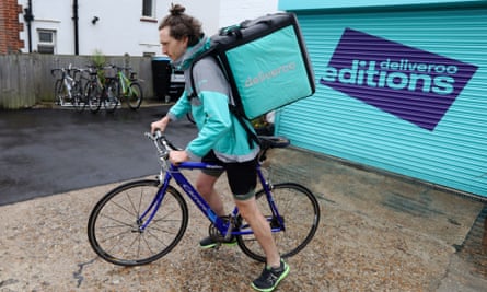 A Deliveroo rider sets off from a Roobox dark kitchen in Hove, Sussex.