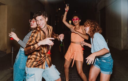 A group of young people dancing in the street