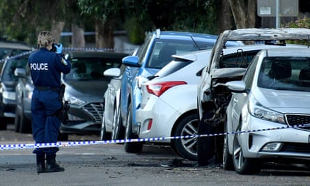 NSW police photograph a burnt out car in Hercules St, Dulwich Hill in Sydney.