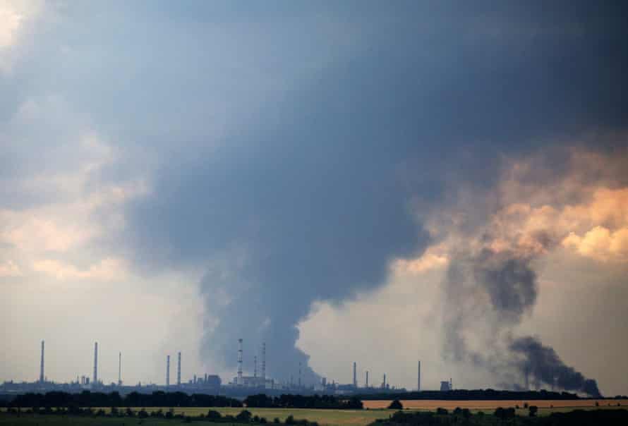Smoke billows over the oil refinery outside the town of Lysychansk yesterday.