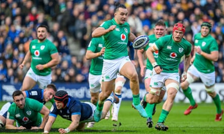 James Lowe breaks clear of Scotland’s defence during Ireland’s dominant victory.