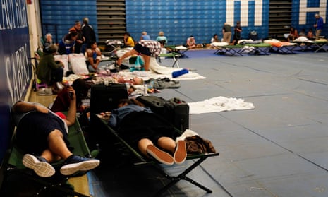 Residents and tourists seek shelter at Maui High School, in Kahului. A large fire consumed the town of Lahaina.