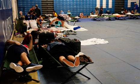 Residents and tourists seek shelter at Maui High School, in Kahului.