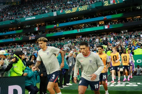 Nico O’Reilly and Jude Bellingham step out onto the pitch