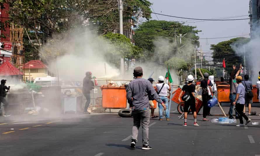 People in Yangon set up a barricade during a protest against the military coup on Saturday.