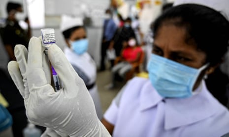 A health worker prepares a dose of the Pfizer coronavirus vaccine in Colombo, Sri Lanka