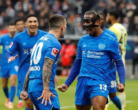 Arthur (right) celebrates scoring Leverkusen’s first goal with Álex Grimaldo