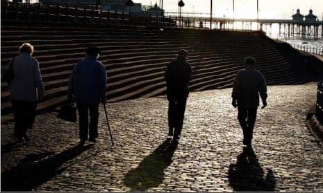 Pensioners, elderly people walk along the promenade as the late afternoon winter sun bathes a chilly Blackpool, Lancashire. 11th December 2007. Picture: CHRISTOPHER THOMOND.